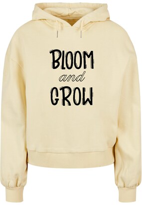 Merchcode Sweatshirt ‘Spring – Bloom and grow’ Geel / Zwart