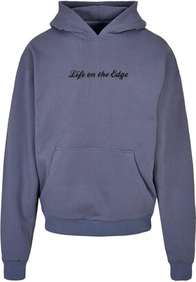 Merchcode Sweatshirt ‘Peanuts – Life on the edge’ Duifblauw / Geel / Zwart / Wit