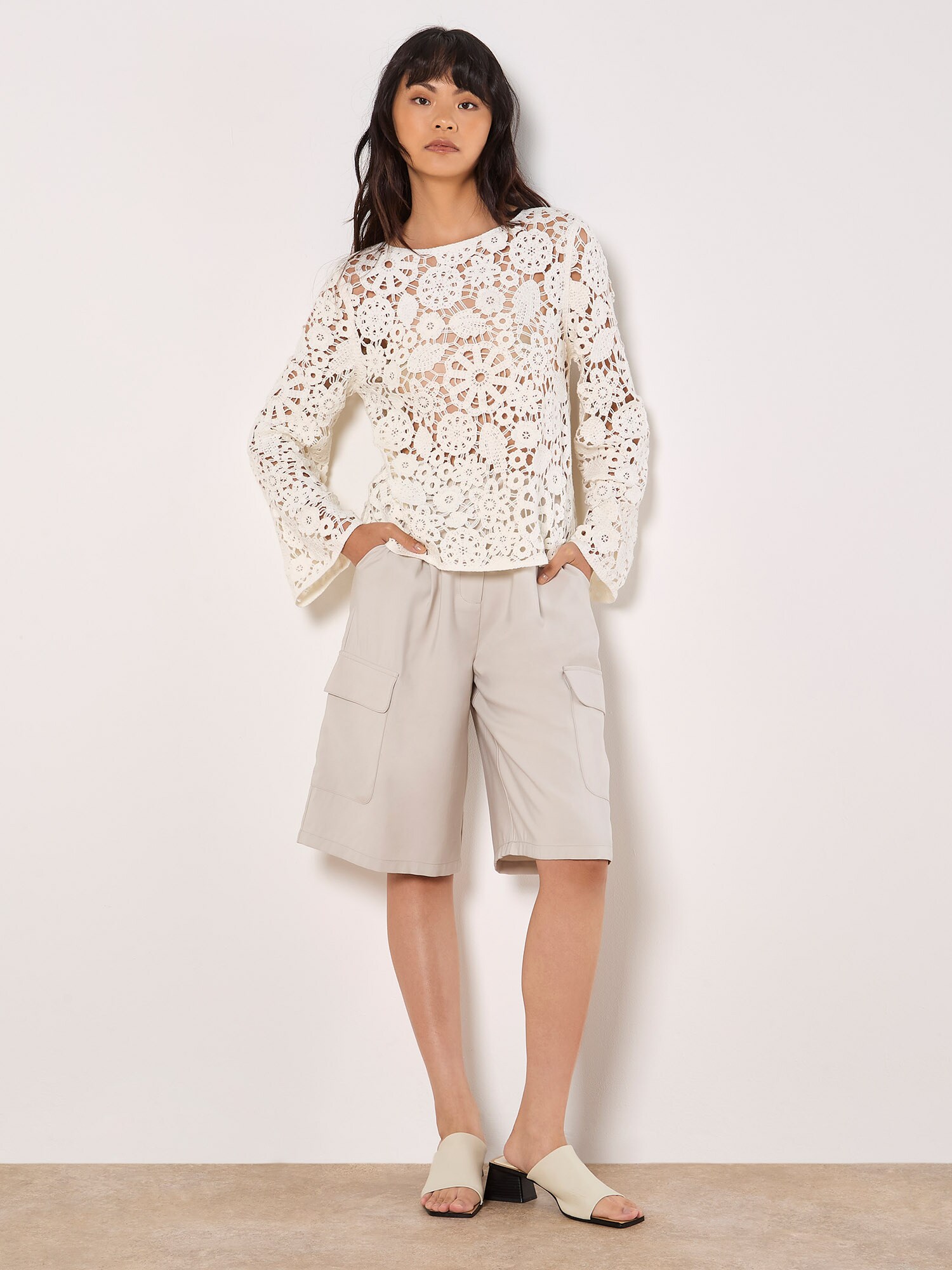 Thumbnail - Apricot Floral Crochet Bell Sleeve Top