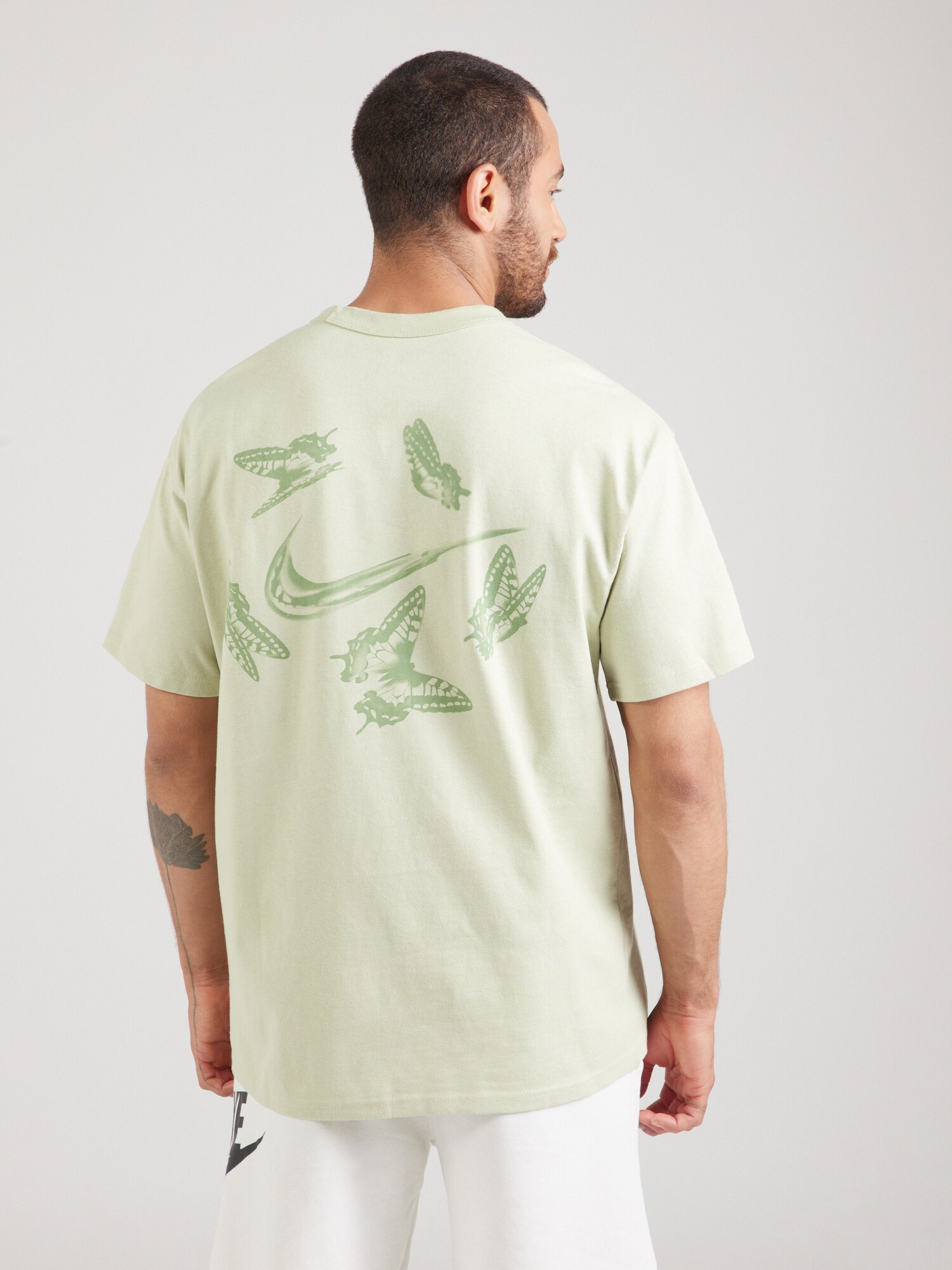 Nike Sportswear Póló  zöld / menta termék 2. képe