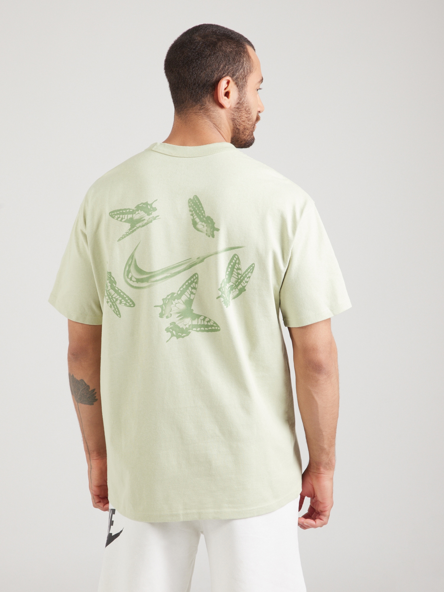 Nike Sportswear Póló zöld / menta termék 2. képe